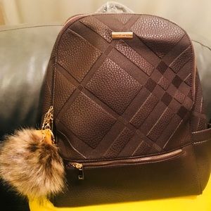Fashionable Backpack with puffy Pom Pom keychain